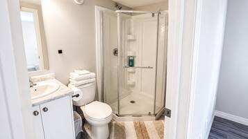 Shower, towels, soap, toilet paper