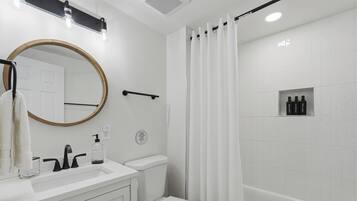 Shower, hair dryer, towels, soap