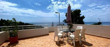 Suite, Balcony, Sea View | Outdoor dining