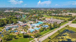 A large water park with multiple pools and water slides. - Gathering Place Pool home Tampa/USF Bush Garden, Adventure Island and Moffit (Tampa)