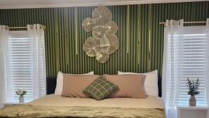 A bedroom with a bed, a ceiling fan, a wall-mounted light fixture, and a window with curtains. - beautifly remodel home with spectacular mountain views 6 miles from the mall (Sierra Vista)