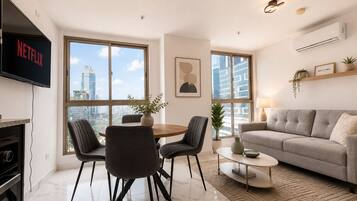 Deluxe Apartment, City View | Minibar, laptop workspace, iron/ironing board, free cots/infant beds