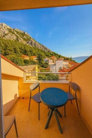 Family Room, 1 Bedroom, Balcony, Partial Sea View | Terrace/patio