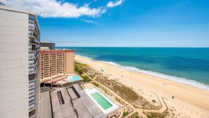 A high-rise hotel with a rooftop pool, beach view, and ocean access. - 2 Bedroom Condo W/ View of Bay & Ocean (Ocean City)