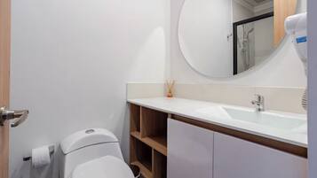 Shower, hair dryer, towels, soap