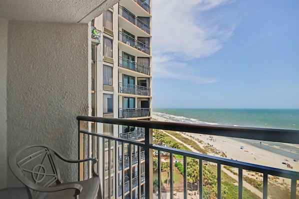A balcony with a view of the beach and ocean. - Oceanfront King w/Balcony & Kitchen | Dog Friendly (Myrtle Beach)