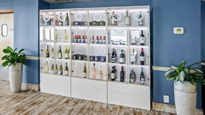 A wall of wine bottles in a hotel lobby. - Oceanfront Studio w/ Two Queens + Beach & Pools (Myrtle Beach)