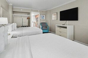 A hotel room with two beds, a TV, a chair, and a dresser. - Oceanfront Studio w/ Two Queens + Beach & Pools (Myrtle Beach)