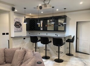 Bar (on property) - Luxury World Cup HQ - 13 min drive to MBS - Near Marta · Bar · Theater · Gym (Atlanta)