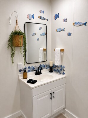 Shower, hair dryer, towels, soap - Ember & Shore is a cozy retreat created for enjoying life’s quieter moments. (Ashville)