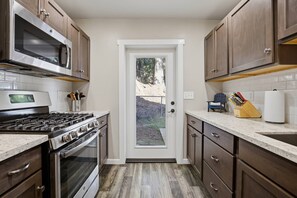 Fridge, microwave, oven, stovetop - Hayden Lake Oasis | Private Dock and Boat Slip | Fire Pit and Lake Access (Hayden)