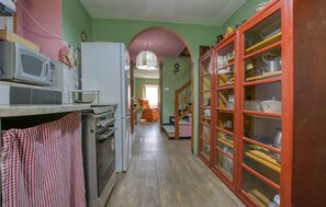 A kitchen with a microwave, oven, and refrigerator. - 3 bedroom stunning home in Rezzoaglio (Rezzoaglio)