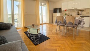 A modern apartment with a living room, dining area, and kitchen. - Apartment Raspolic no.2 by Interhome (Opatija/Kastav)