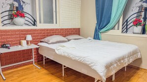 A bedroom with a bed, a desk, a window with curtains, and a wall with a poster. - 3BR Seongsu Station 3min walk Urban Cozy House2 (Seoul)