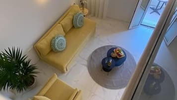 Family Apartment, Balcony, City View | Living area | Flat-screen TV