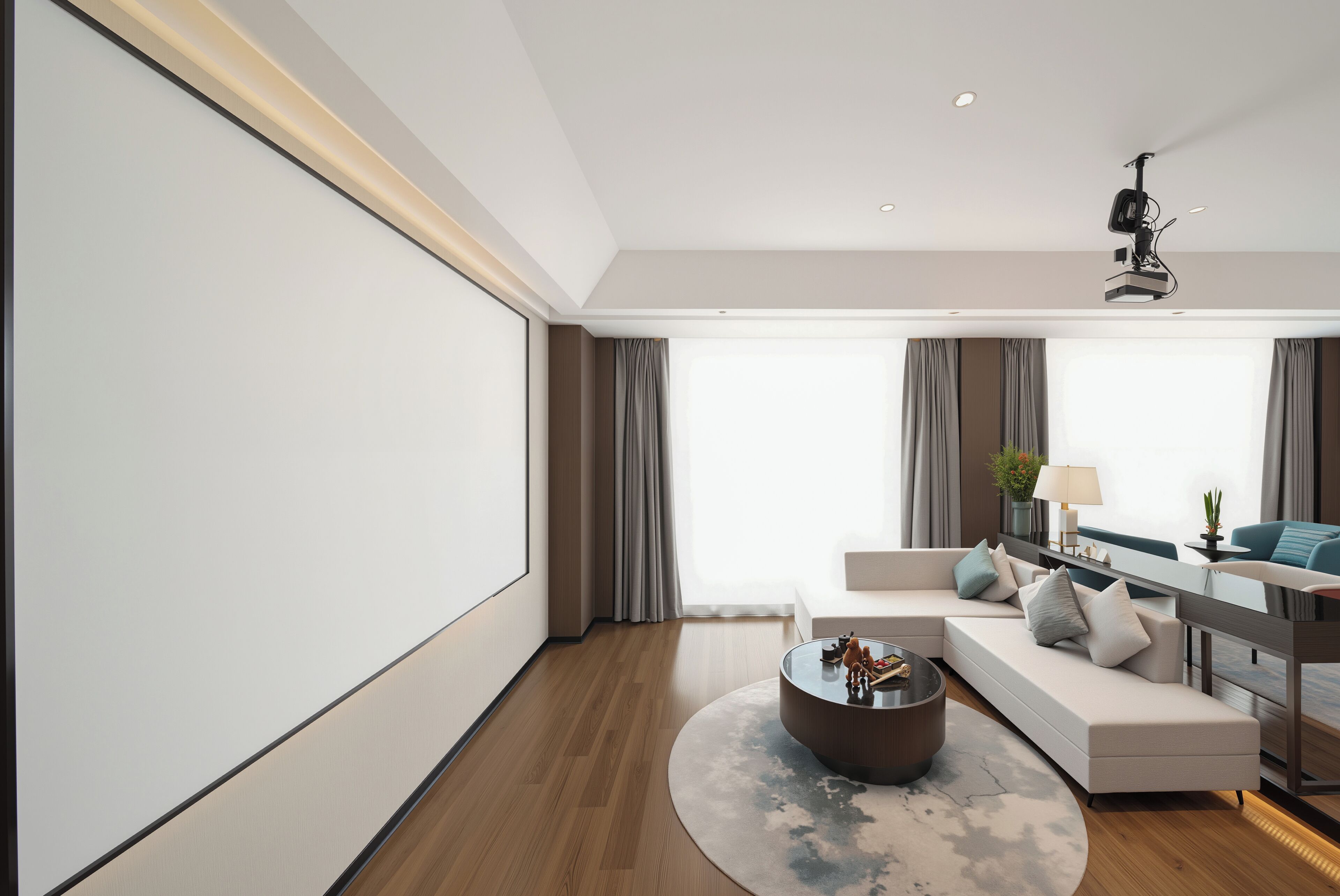 Una sala moderna con un televisor de pantalla plana grande, un conjunto de sofás, una mesa de centro y un comedor con mesa y sillas.