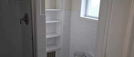 Shower, towels, soap, toilet paper