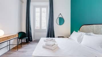 Desk, iron/ironing board, travel cot