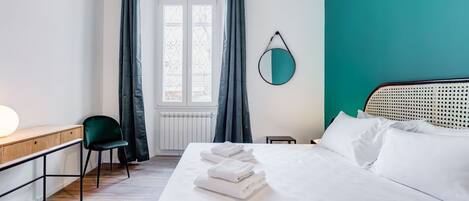 Desk, iron/ironing board, travel crib