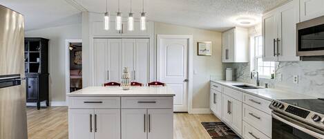 Fridge, microwave, stovetop, coffee/tea maker