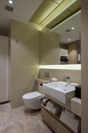 Shower, slippers, towels, soap - Nivasana Residences Vadodara  (VADODARA)