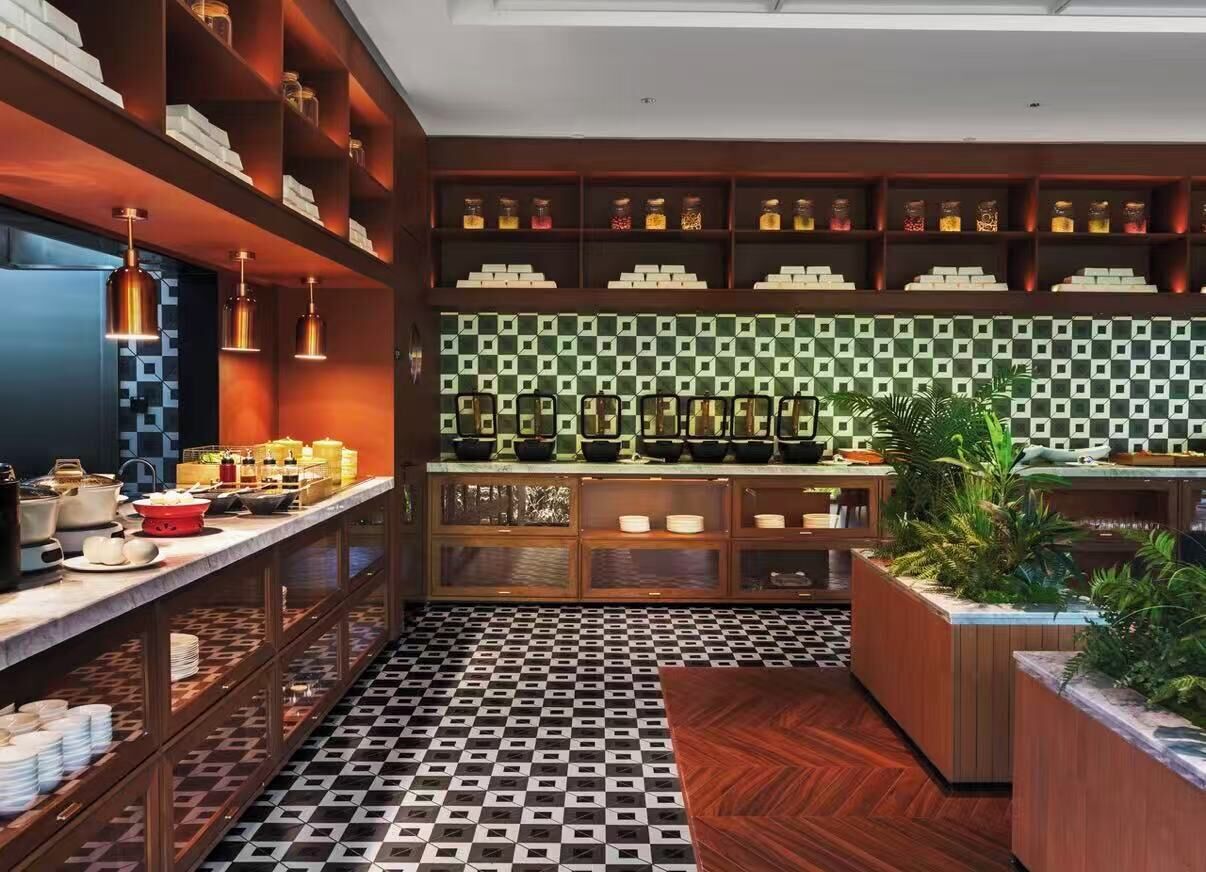 A modern kitchen with wooden shelves, a patterned backsplash, and a checkered floor.
