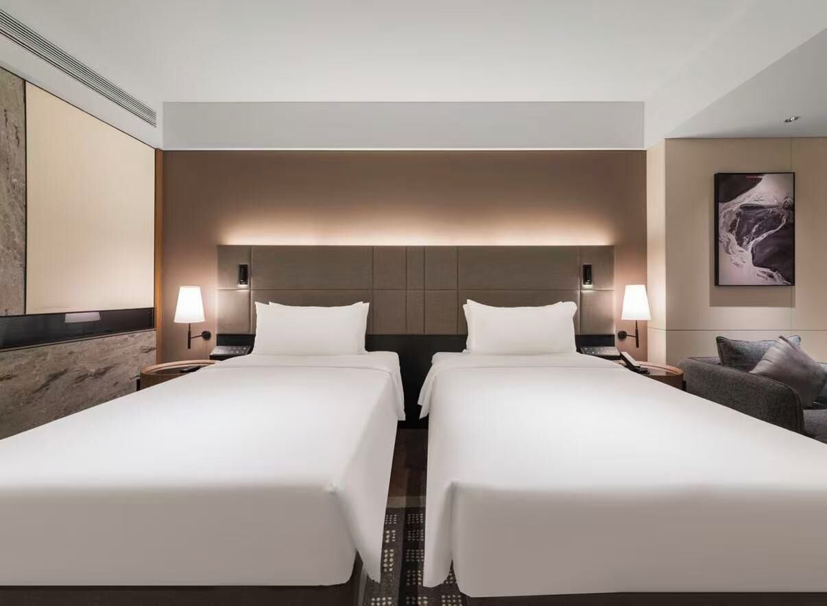 Basic Twin Room | Down duvets, free minibar, individually decorated