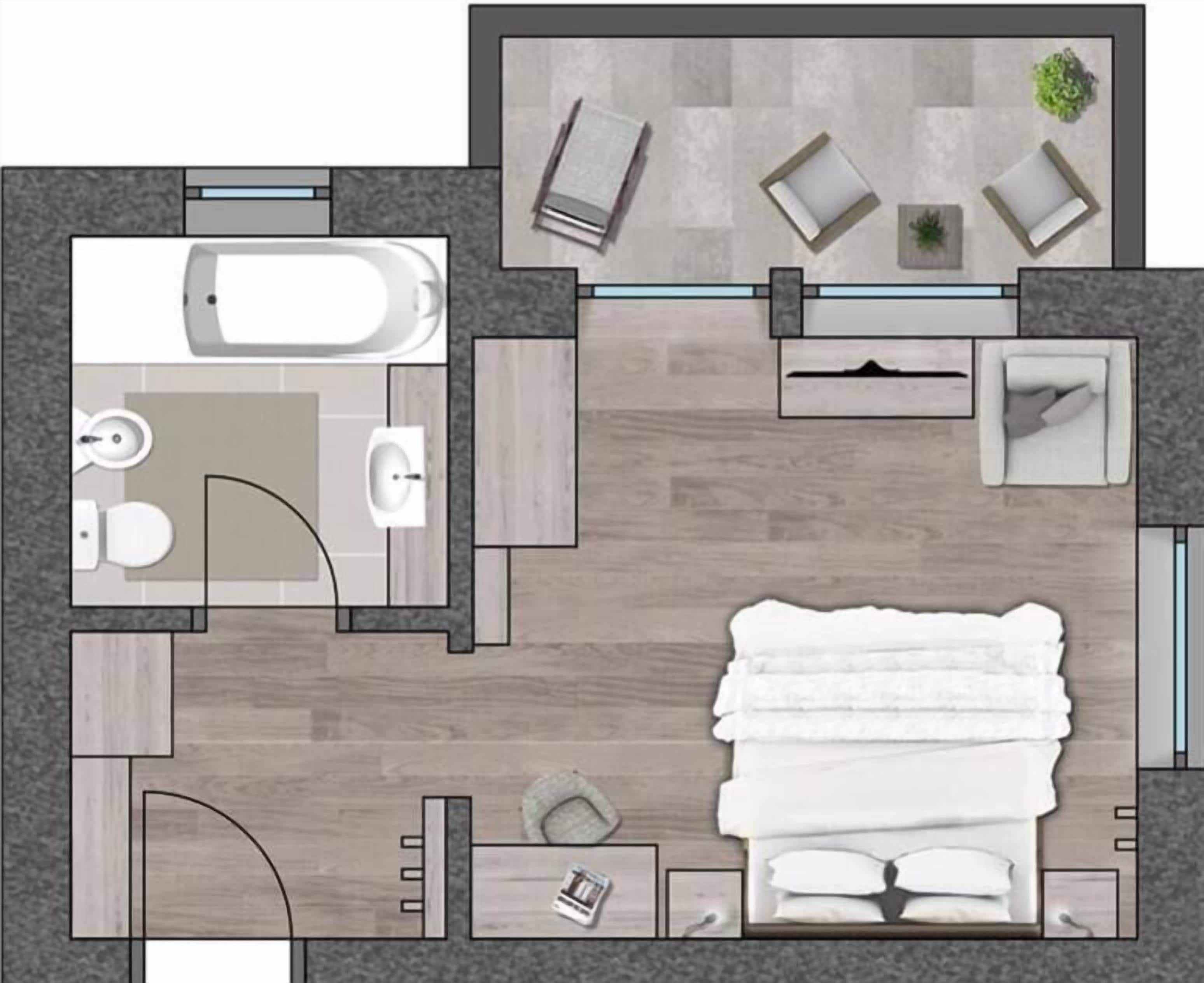 Habitación de hotel con cama, baño, zona de estar con mesa y sillas, y un pequeño balcón con una planta.