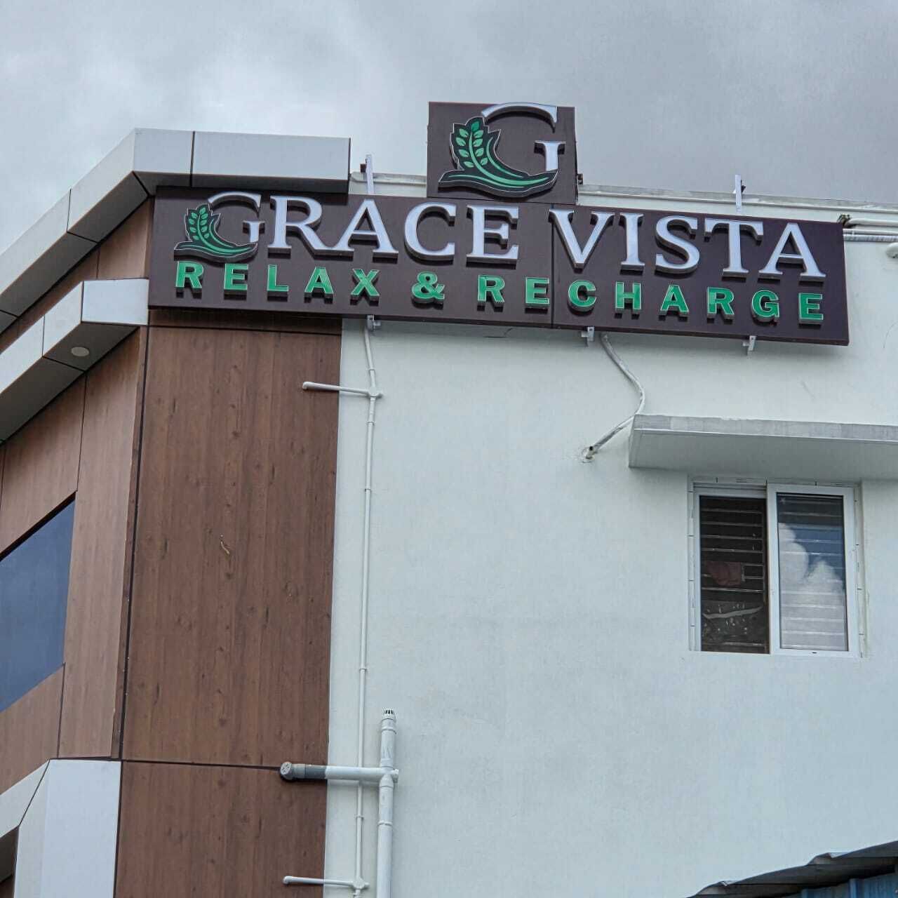 A building with a sign that reads 'GRACE VISTA RELAX & RECHARGE.'