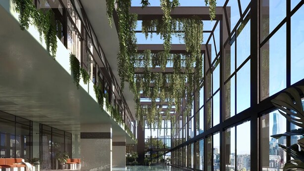 An indoor swimming pool with glass walls, a high ceiling, and hanging plants. - Bright Apt Southbank Near Crown Casino ,pool &gym (Melbourne)