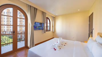Deluxe Room, Balcony, City View | Minibar, individually decorated, laptop workspace, blackout curtains