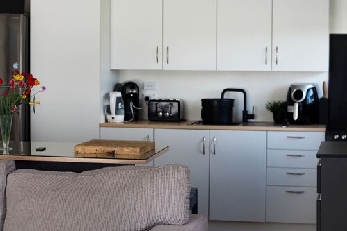Stylish 1BR Retreat | Patio | Walk to Shops | Parking