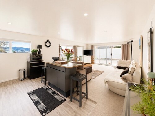 Stylish 1BR Retreat | Patio | Walk to Shops | Parking