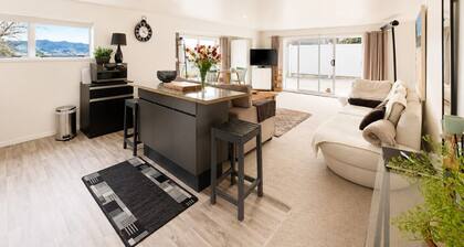 Stylish 1BR Retreat | Patio | Walk to Shops | Parking