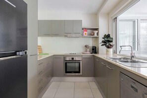 Fridge, microwave, oven, stovetop - A Calm City Base | Cairns CBD (Cairns North)