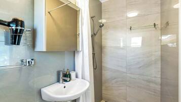 Shower, hair dryer, shampoo