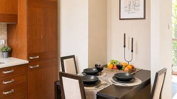 Comfort Apartment, City View | Private kitchen | Fridge, oven, stovetop, highchair