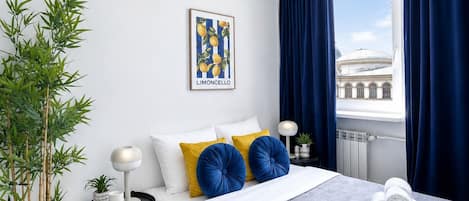 Premium bedding, desk, laptop workspace, blackout curtains