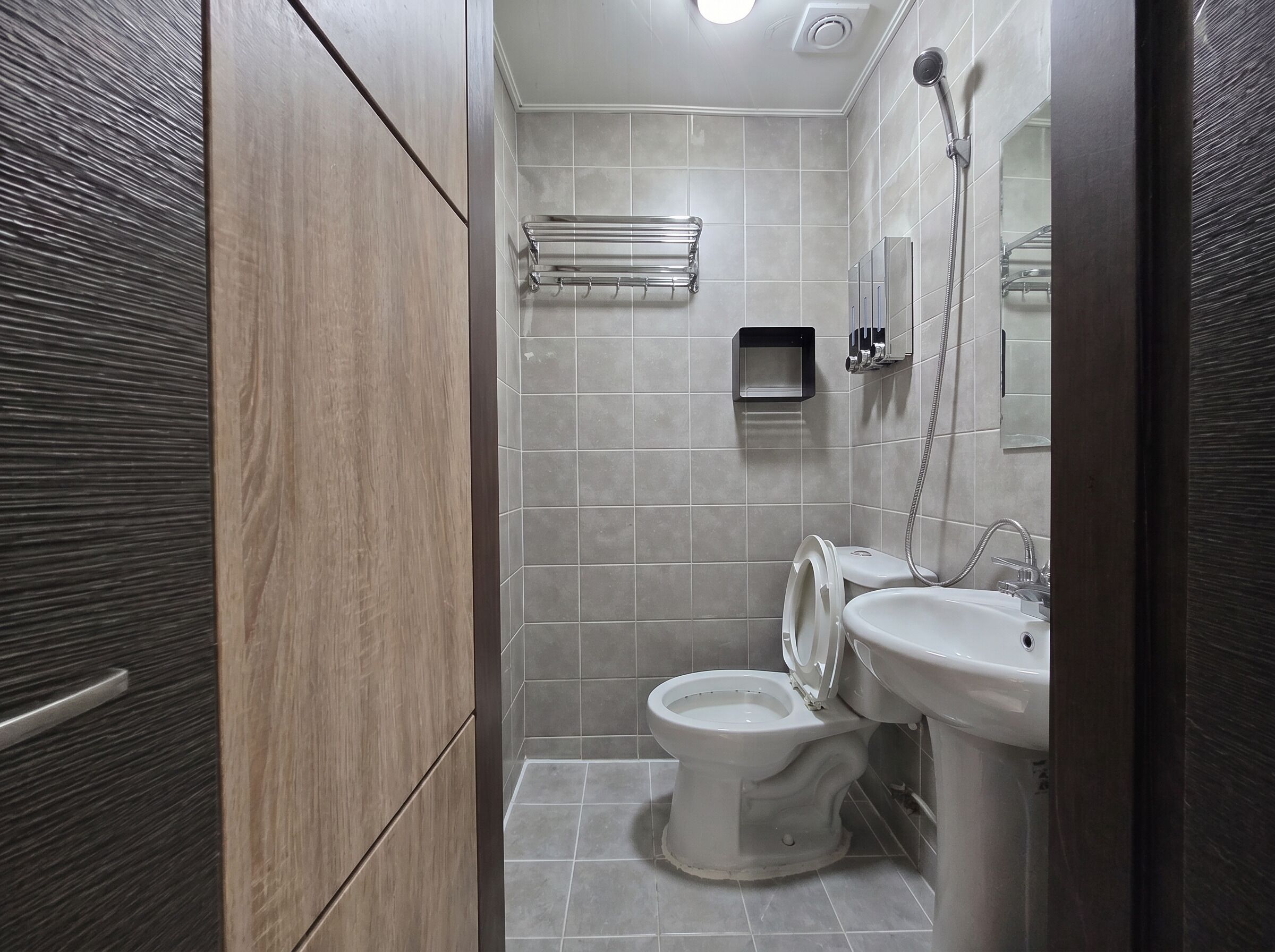 Shower, hair dryer, slippers, towels