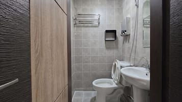 Shower, hair dryer, slippers, towels