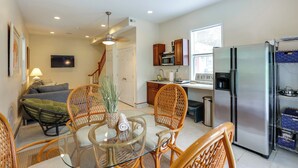 A modern kitchen with a refrigerator, microwave, and wooden cabinets. - Potomac Riverfront! Home Near St Clements Island (Coltons Point)