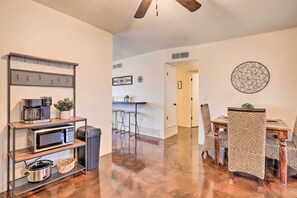 A modern kitchen with a microwave, coffee maker, and a hanging rack. - Groups Welcome! 2-home Tucson Escape w/ Fire Pit (Tucson)