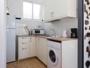 Fridge, microwave, cookware/dishes/utensils