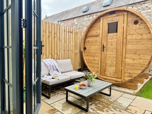 A wooden door, a sofa, a table with fruit, and a glass of juice. - Luxury/Hot tub/sauna/Sleeps 9/ Parking (Chepstow)