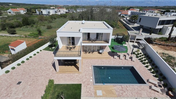 A modern two-story house with a rooftop terrace, a swimming pool, and a view of distant mountains. - 3-bedroom villa in gorgeous Zaton with cool AC (Zaton)