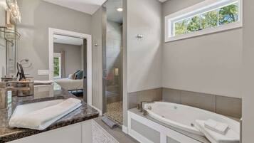 Shower, hair dryer, towels, shampoo