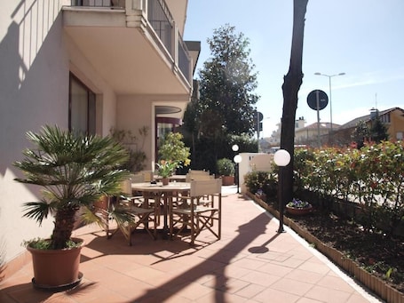 Outdoor dining. Arcangelo Roof Hotel