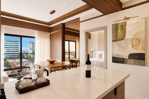 A modern hotel room with a large window, a dining area, and a bed. - ®{Niza~City~Tower} @DowntownSD +Pool+Gym+Balcony (Santo Domingo)