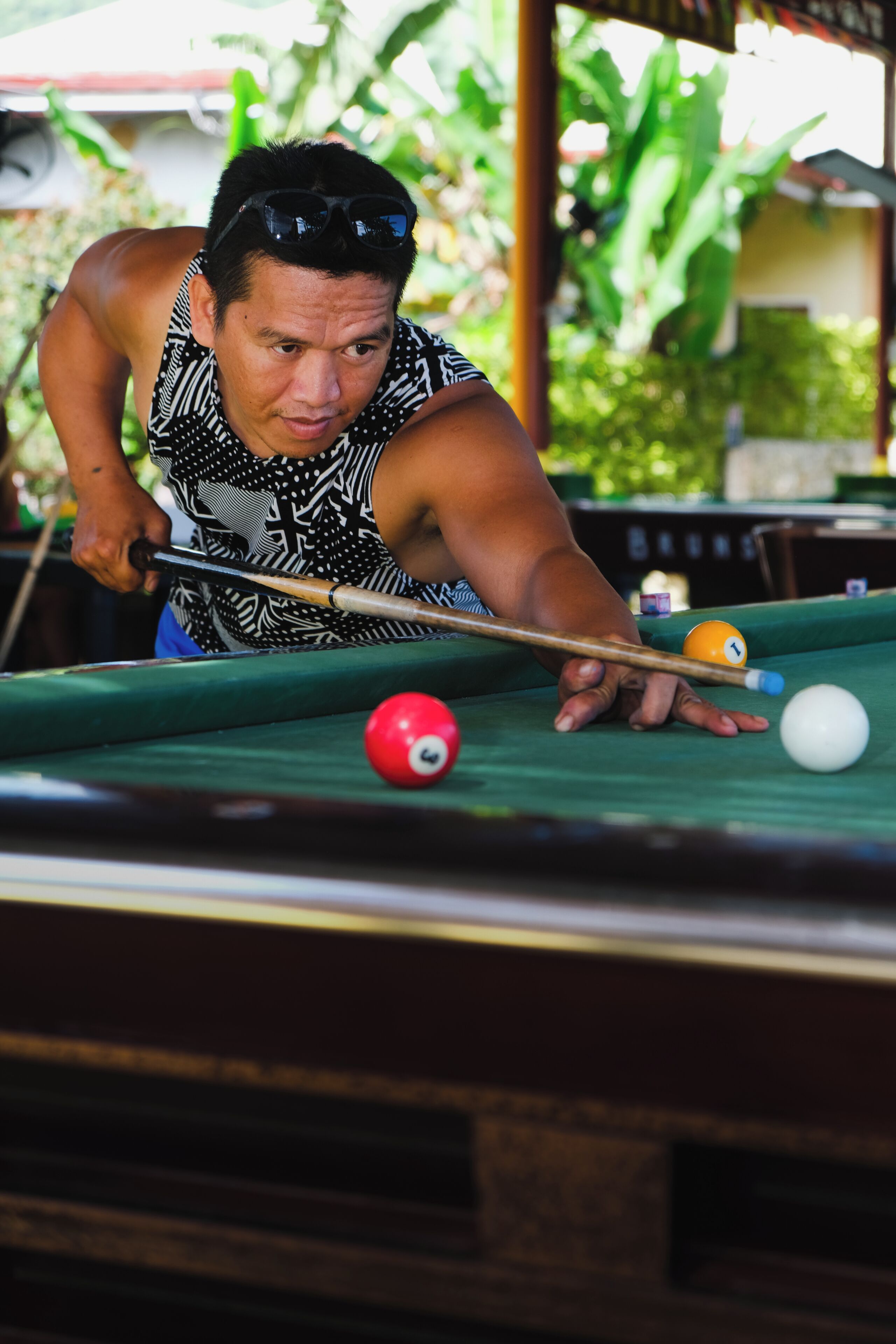 A person playing pool.