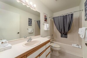 Bathtub, hair dryer, towels, soap